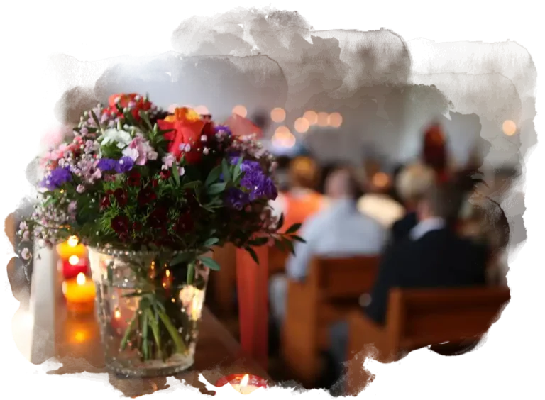 Traditional funeral in a church with flowers.