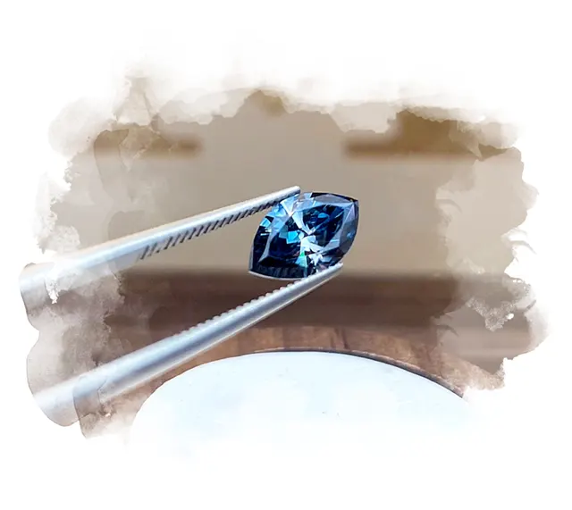 2 carat marquise cut dark blue diamond made from hair.